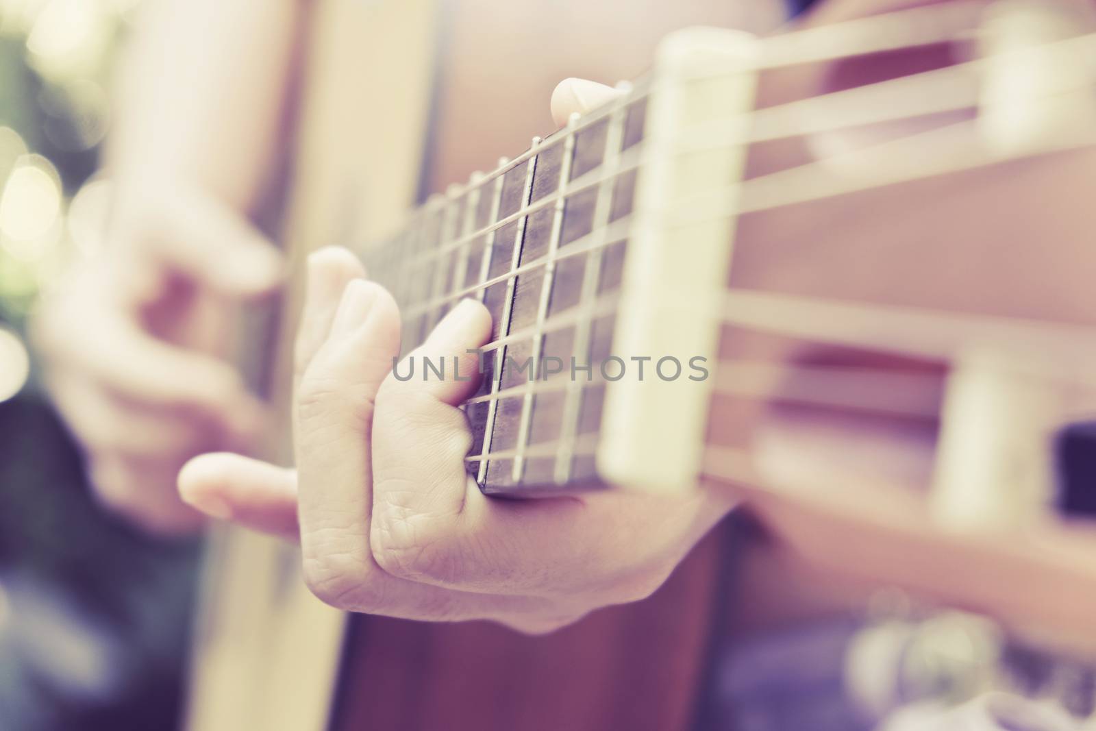 Close up image of Man playing his guitar Background
