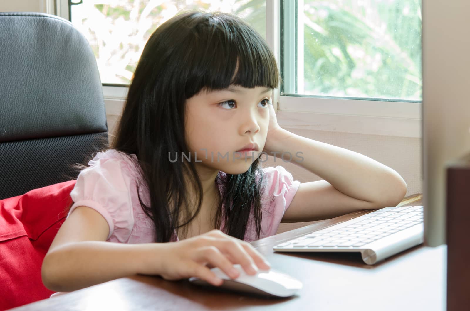 Girl sitting attentively Computer