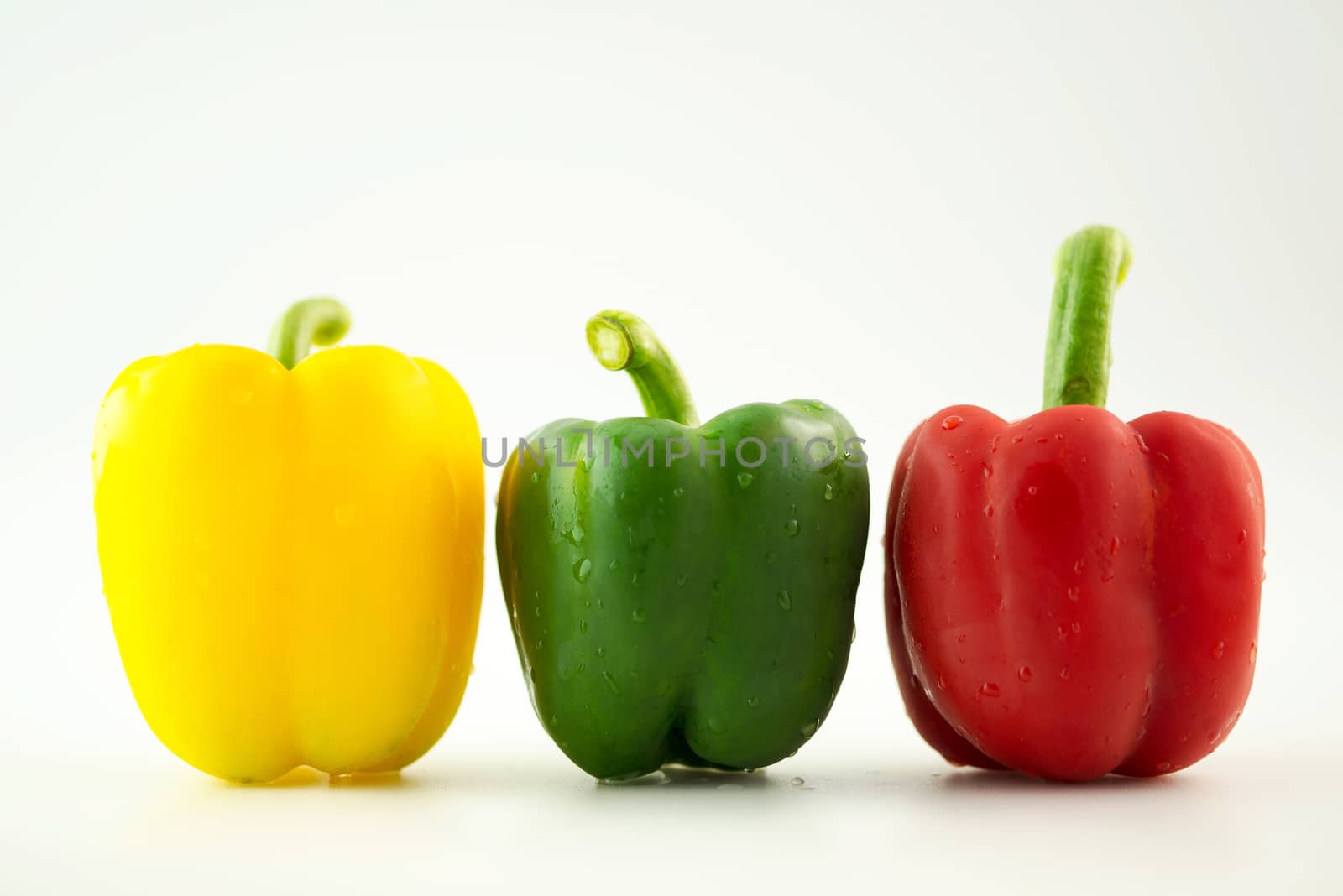 Bell pepper,3 colors capsicum or sweet pepper on white backgroun by Yuri2012