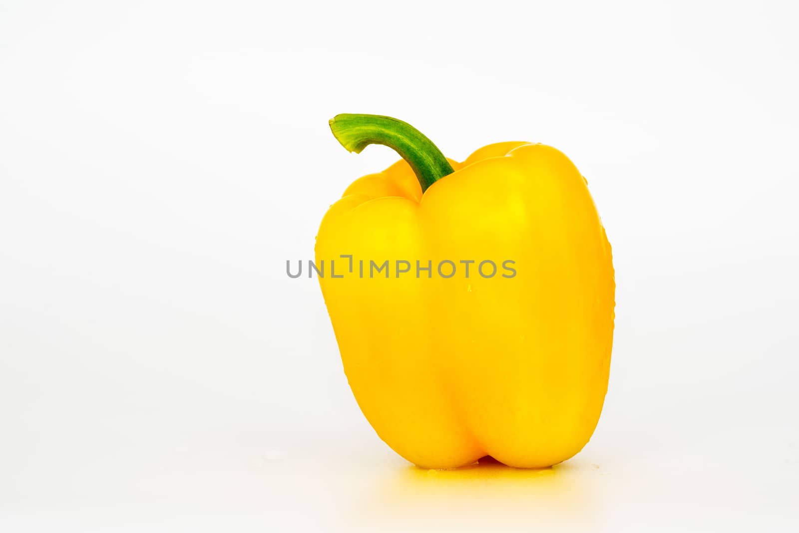 Yellow Sweet bell pepper (capsicum) isolated on white background