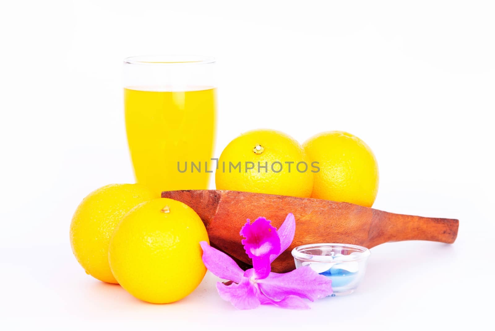 Orange fruit in white bowl on white background .