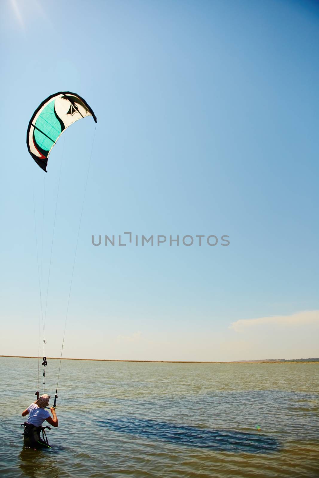 young woman kite-surfer by sarymsakov