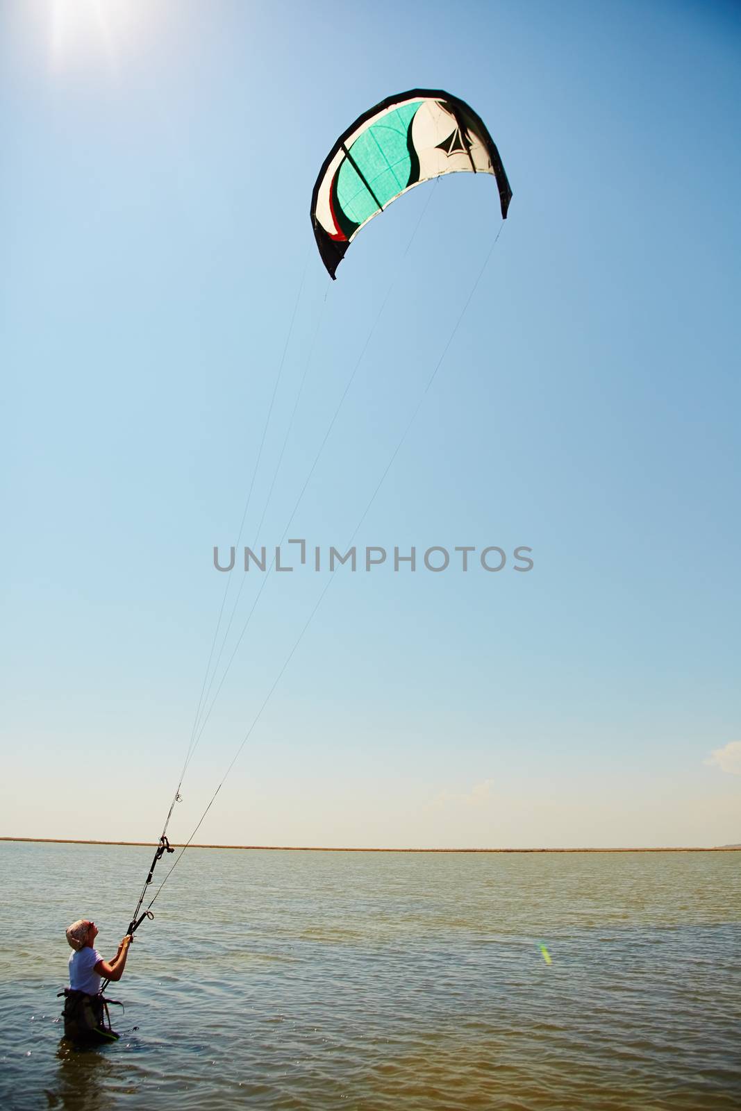 young woman kite-surfer by sarymsakov