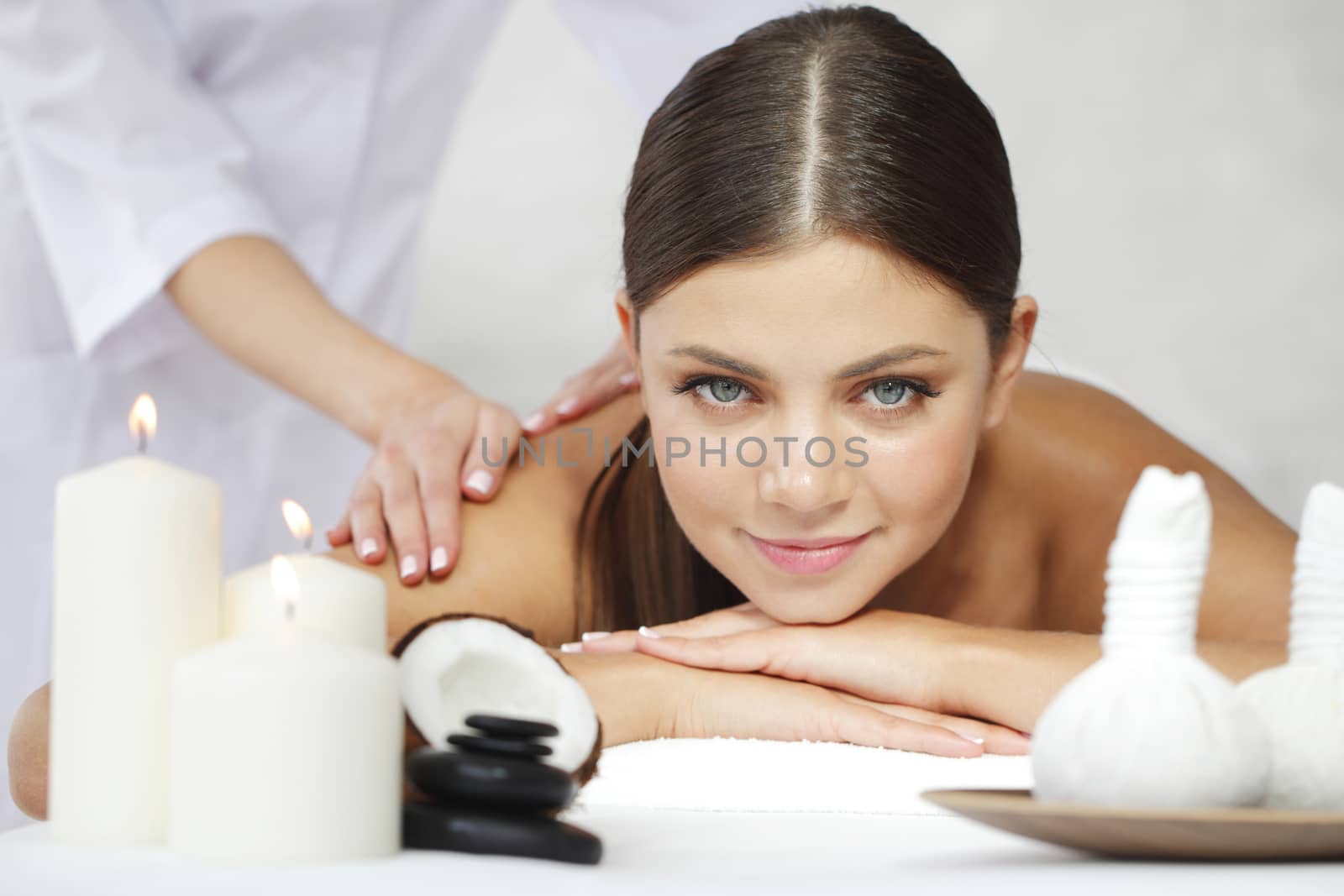 Beautiful young woman getting spa massage close up