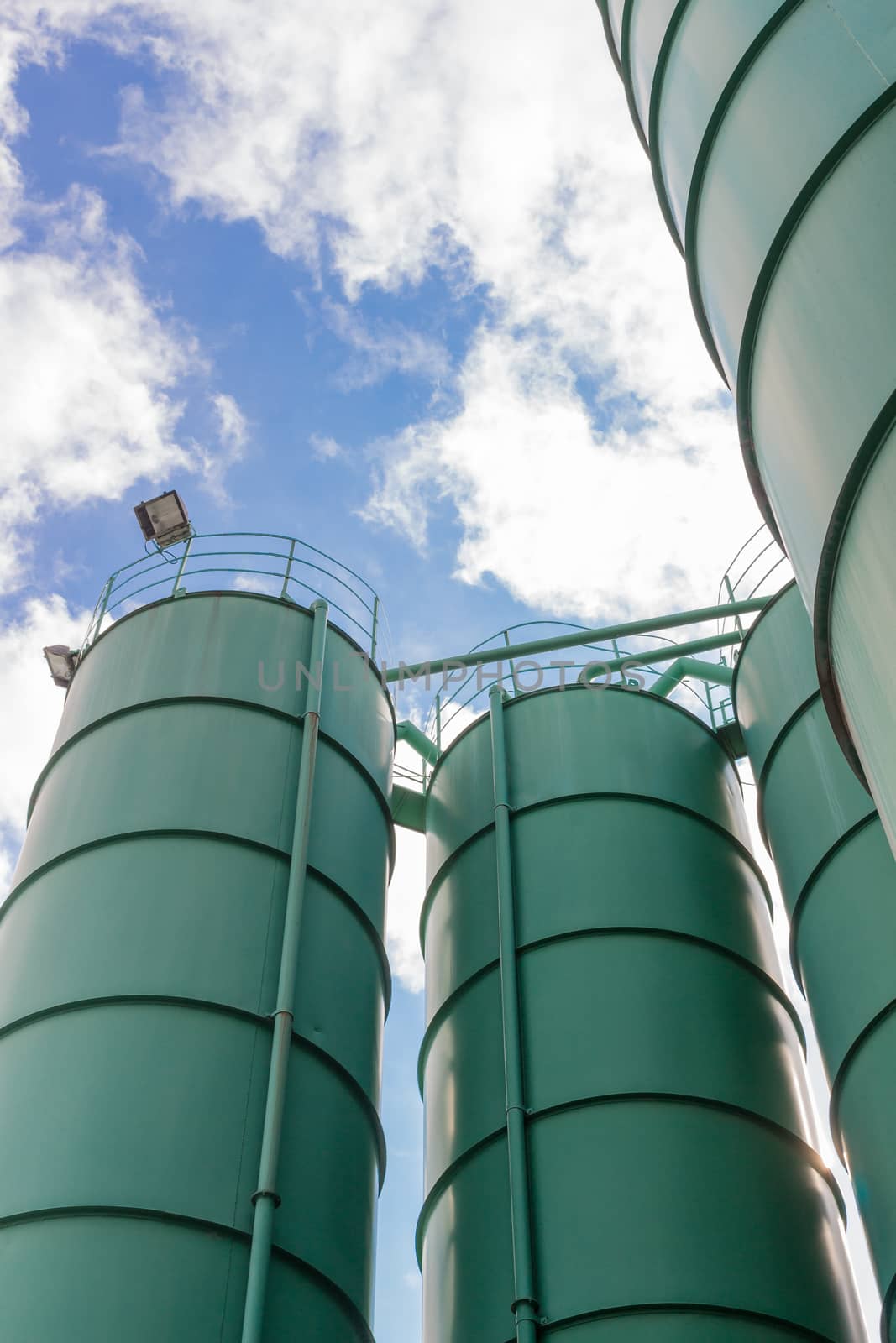 Four industrials silos at a factory.