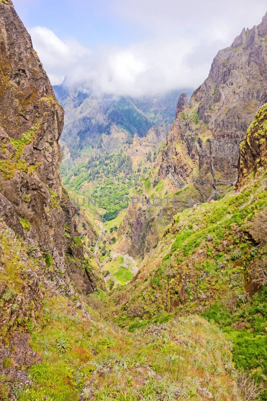 Hiking trail passage from mountain Pico Arieiro to Pico Ruivo, Madeira - colorful volcanic mountain landscape