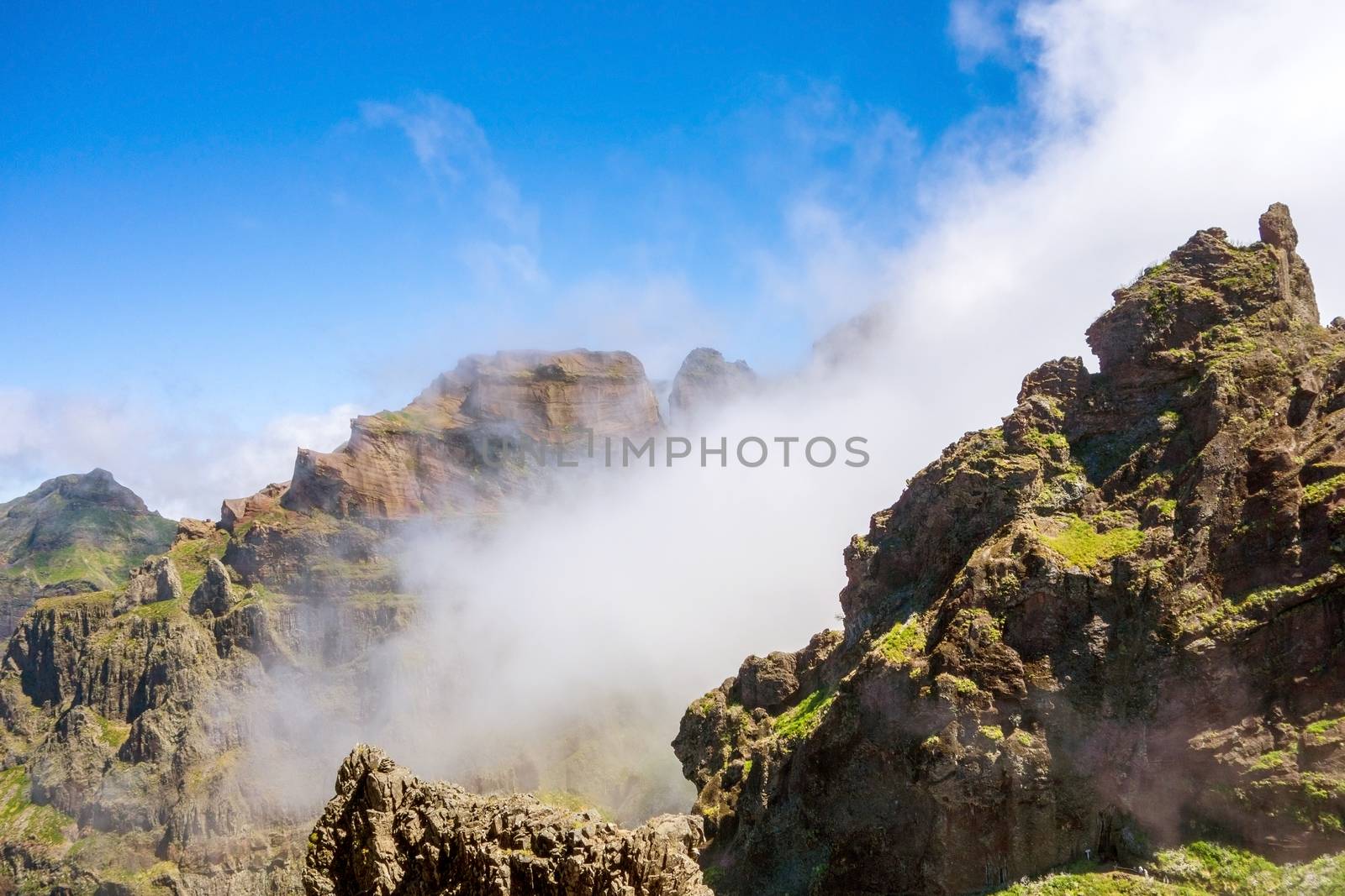 Hiking trail passage from mountain Pico Arieiro to Pico Ruivo, Madeira - colorful volcanic mountain landscape