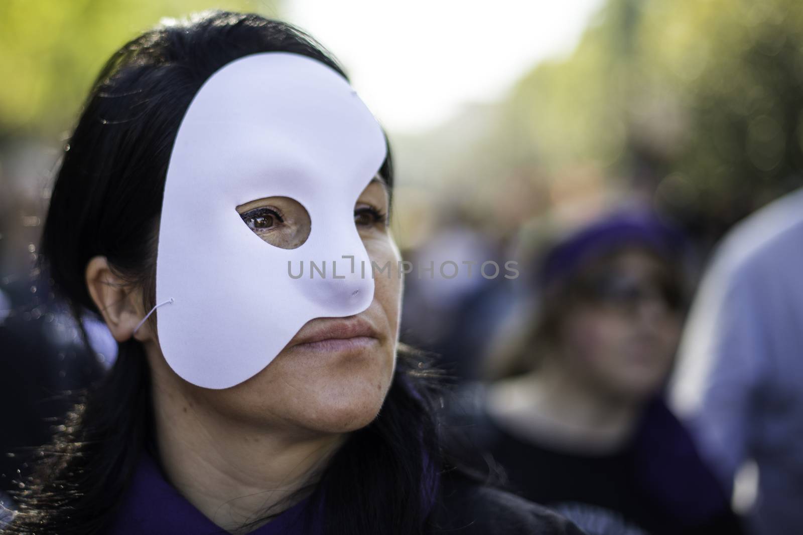 SPAIN, Madrid: A woman dons a mask as thousands of protesters from across Spain march through Madrid on November 7, 2015 in a rally against gender violence. In Spain, more than 1,390 women have reportedly been murdered by male attackers since 1995; this year, 84 cases involving the murder of women by men have been reported thus far.