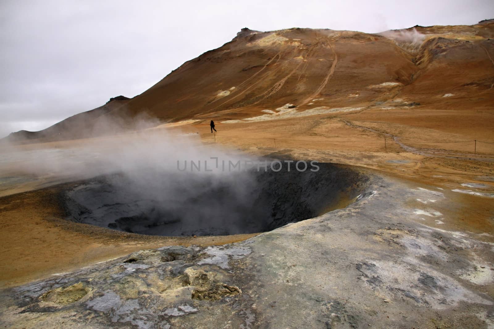 volcano and geyser with steam in national park,Iceland