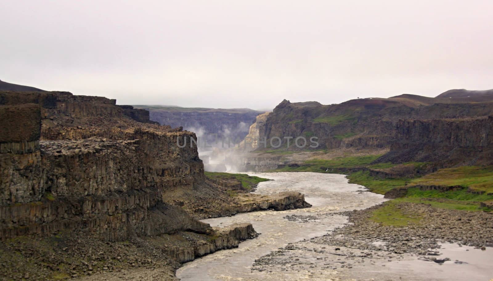 The river and waterfall on background,Iceland