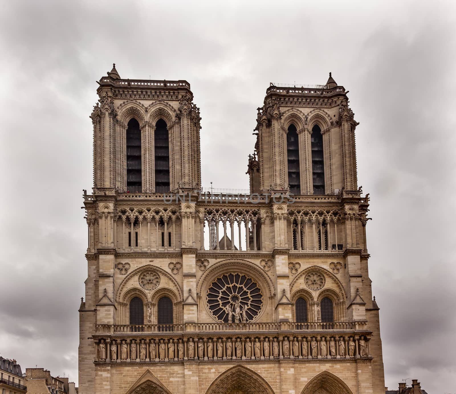 Facade Towers Overcast Skies Notre Dame Cathedral Paris France.  Notre Dame was built between 1163 and 1250AD.  