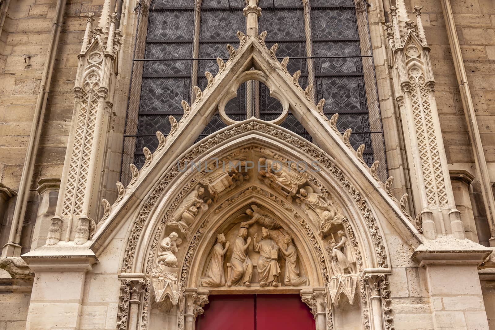 Biblical Statues Little Red Door Notre Dame Cathedral Paris France.  Notre Dame was built between 1163 and 1250AD.  