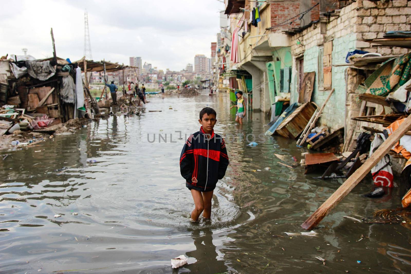 EGYPT, Alexandria: People are seen in the flooding road after a torrential rain caused flood in the Kafr El Arab neigborhood in west of Alexandria, Egypt on November 07, 2015.