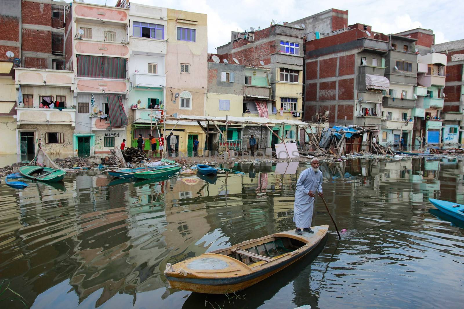 EGYPT, Alexandria: People are seen in the flooding road after a torrential rain caused flood in the Kafr El Arab neigborhood in west of Alexandria, Egypt on November 07, 2015.