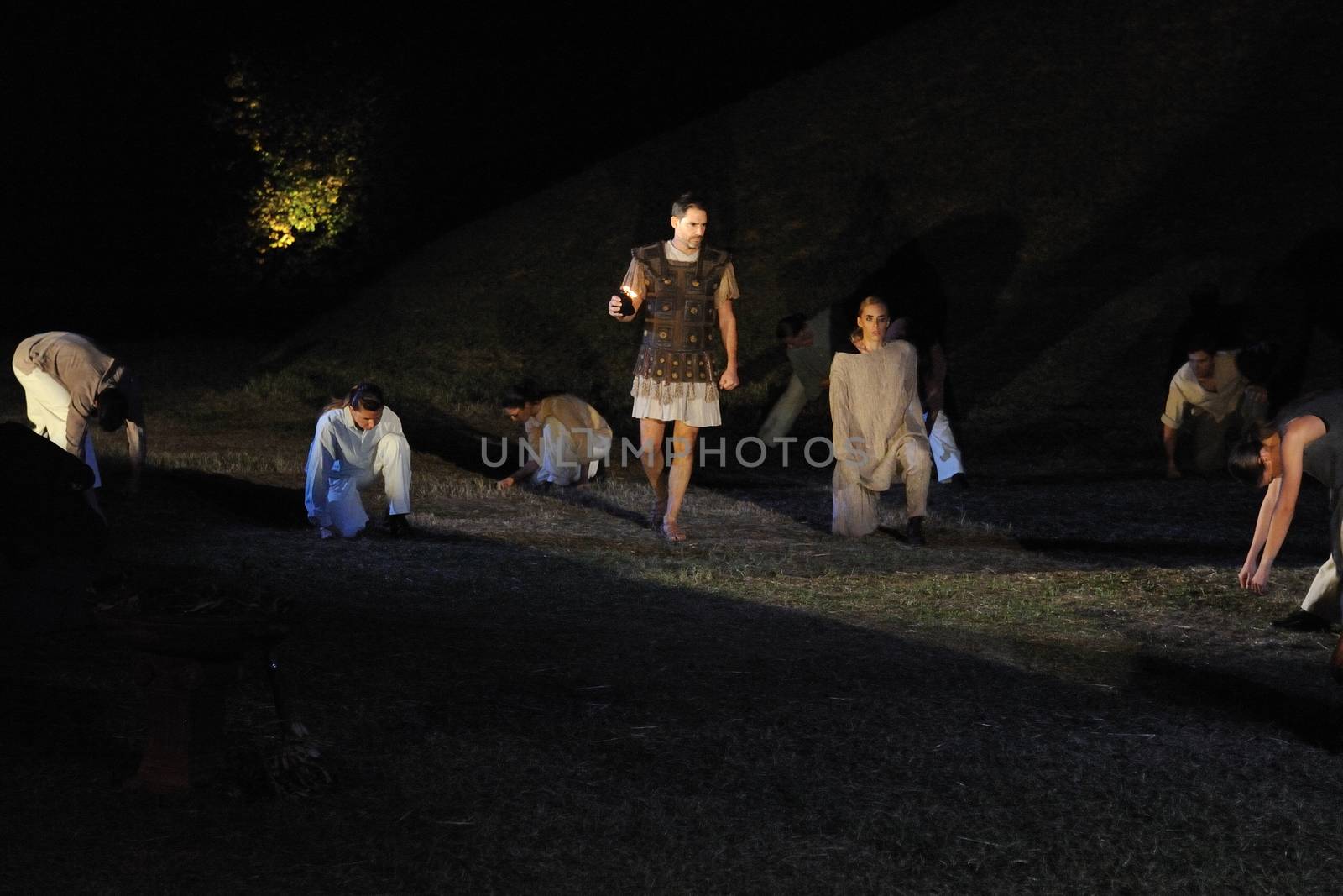GREECE, Athens: Actor Leonidas Argyropoulos proceeds to light the altar during the Ceremony of the Lighting of the Marathon Flame at the Marathon Tomb in Athens, Greece, on November 7, 2015.