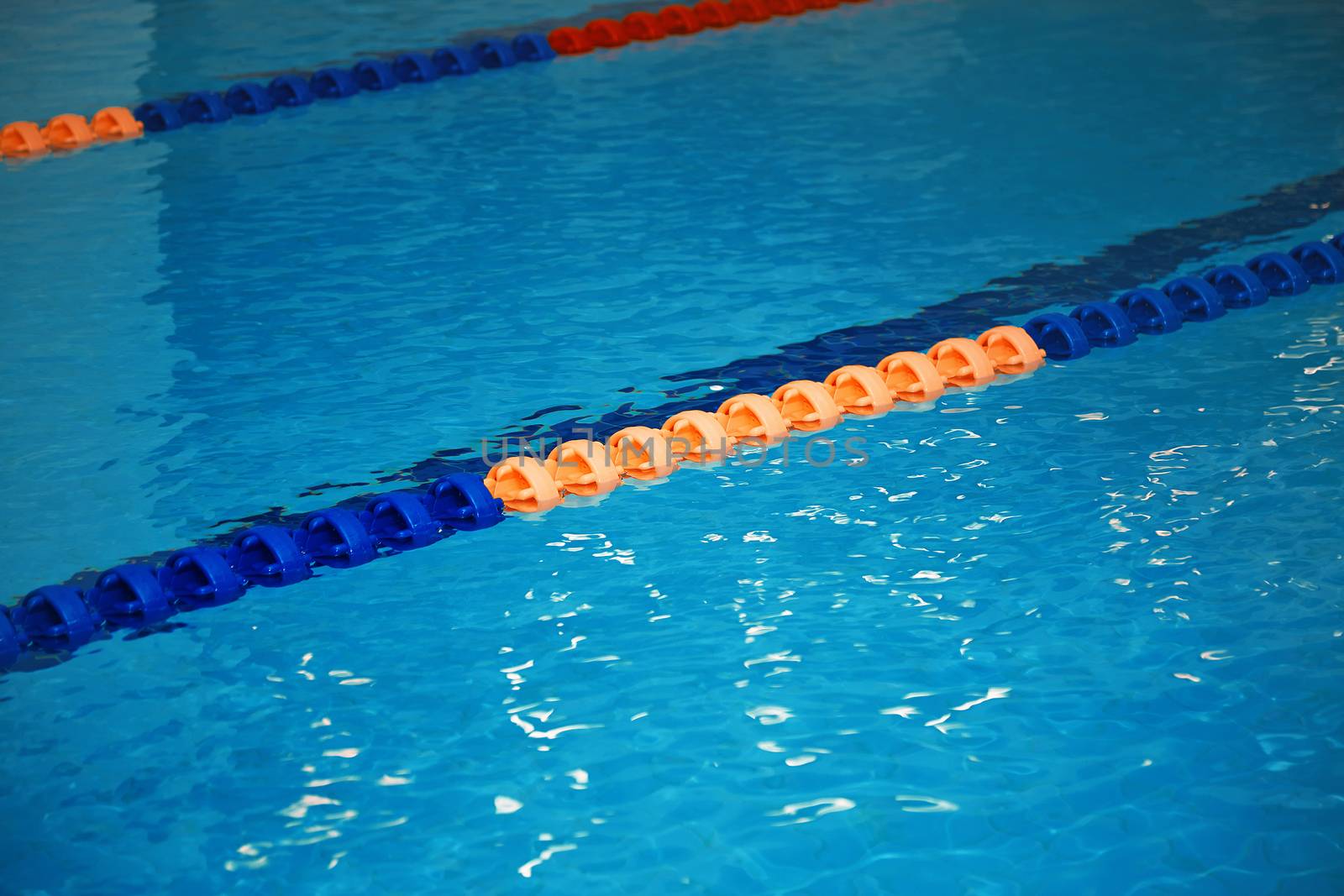 Swimming pool with lane markers. Vertical photo