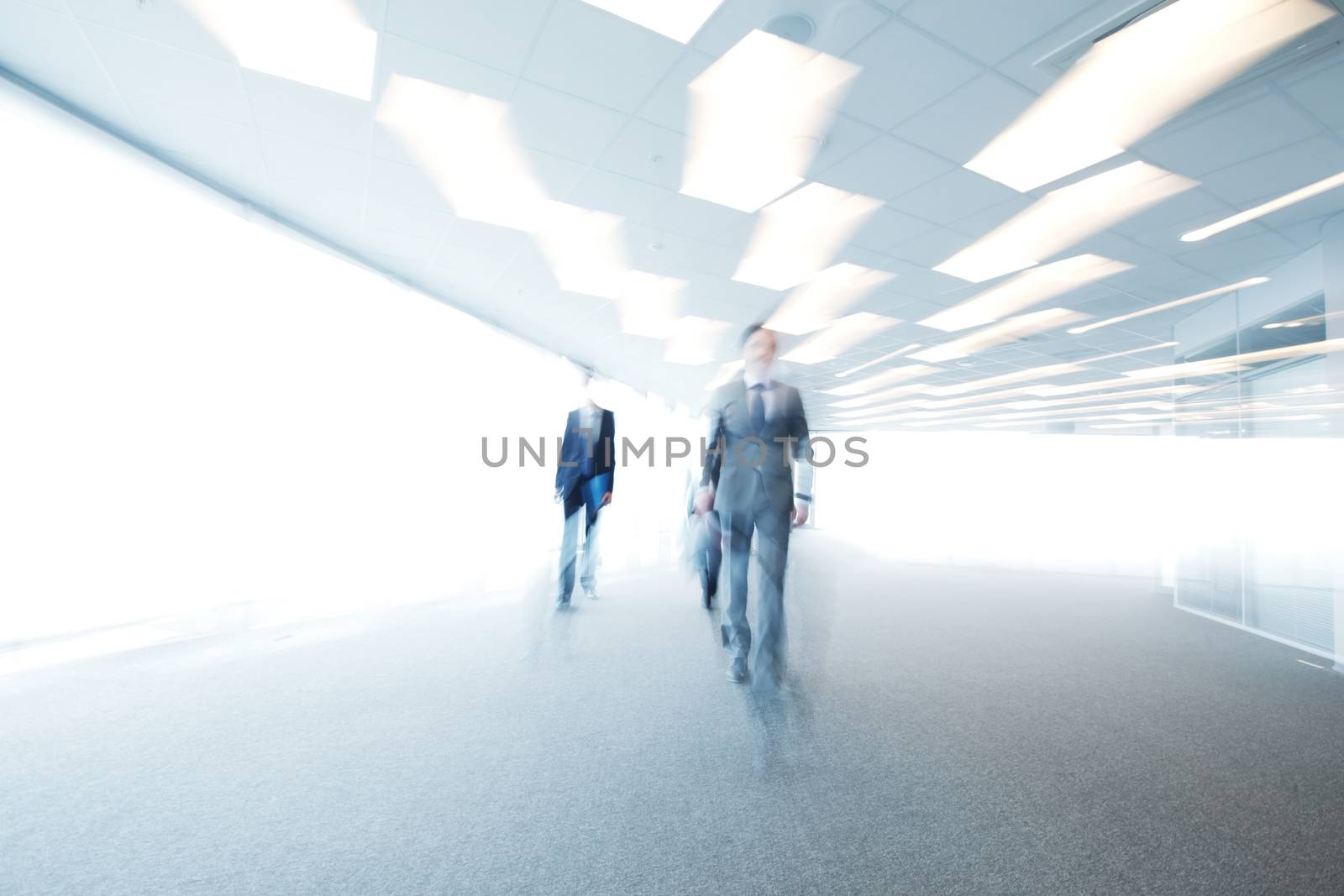 Blurry portrait of walking businessman by ALotOfPeople