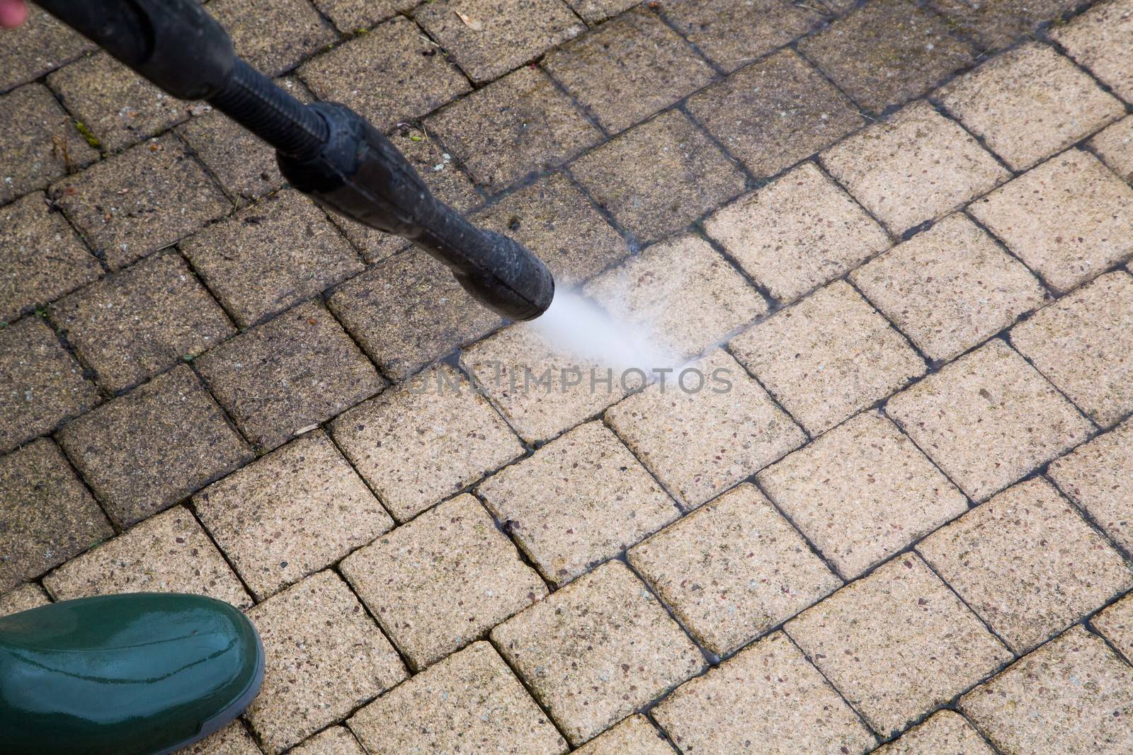 Outdoor floor cleaning with high pressure water jet