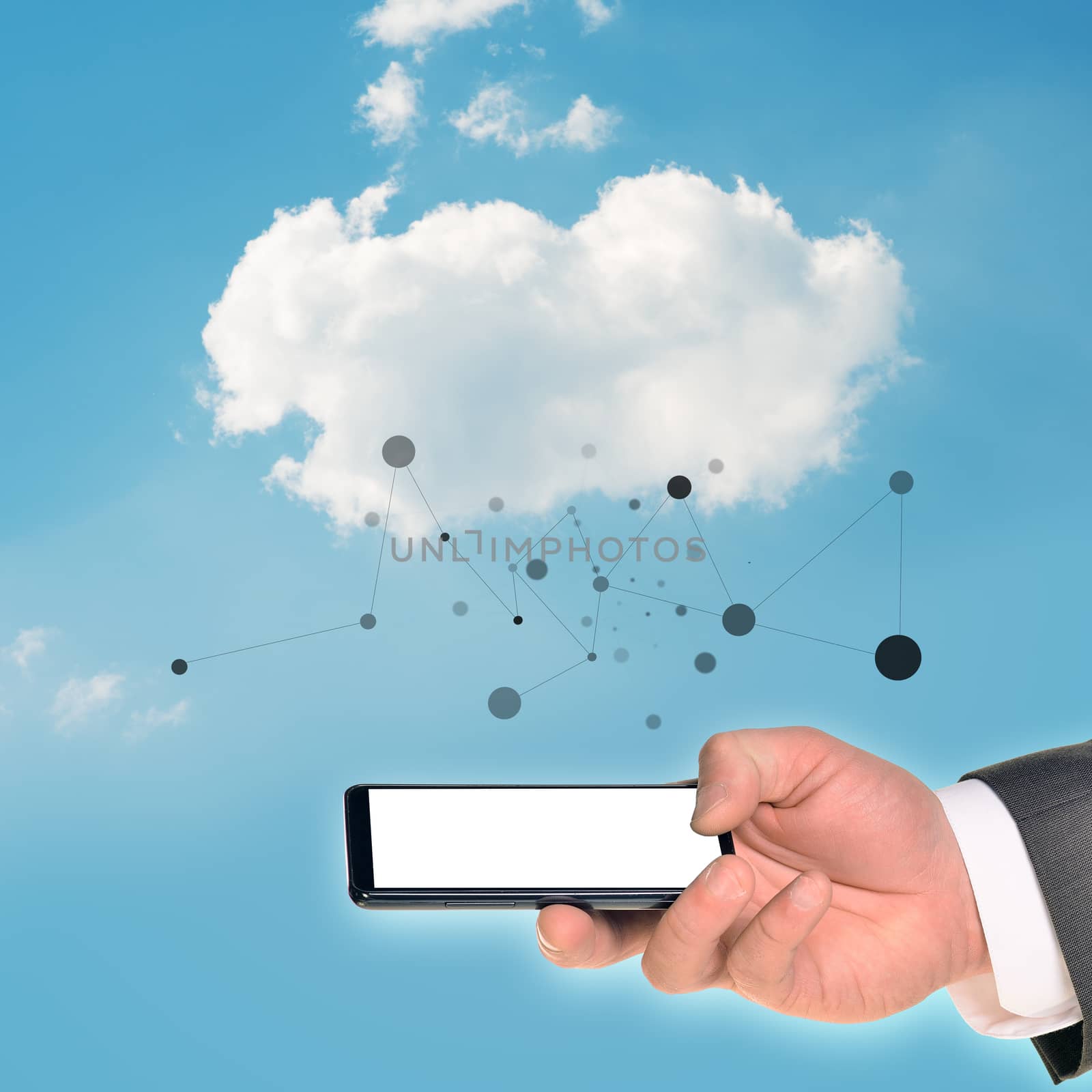 Businessman hand holding smartphone on blue sky background