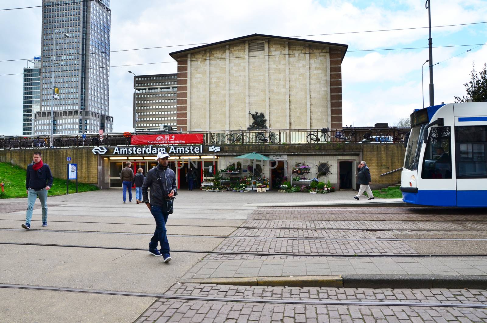 Amsterdam, Netherlands - May 6, 2015: People at Amsterdam Amstel Central Station on May 6, 2015 in Amsterdam, Netherlands.