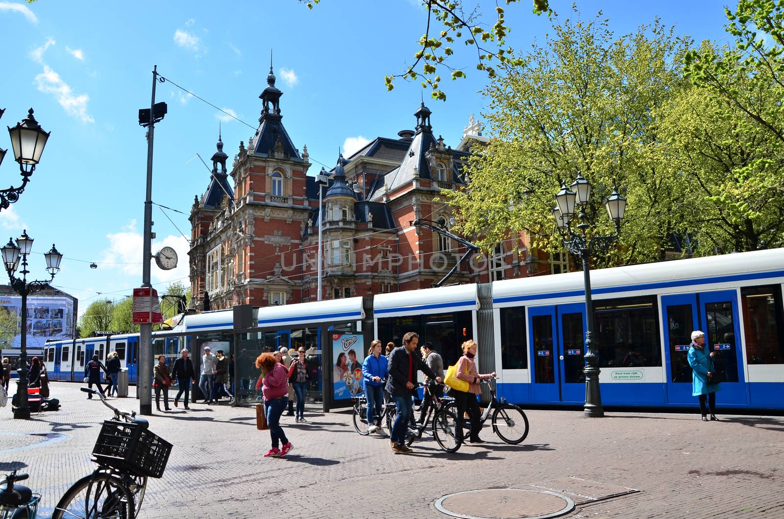 Amsterdam, Netherlands - May 6, 2015: People around Stadsschouwburg building (Municipal theater) at Leidseplein in Amsterdam, Netherlands