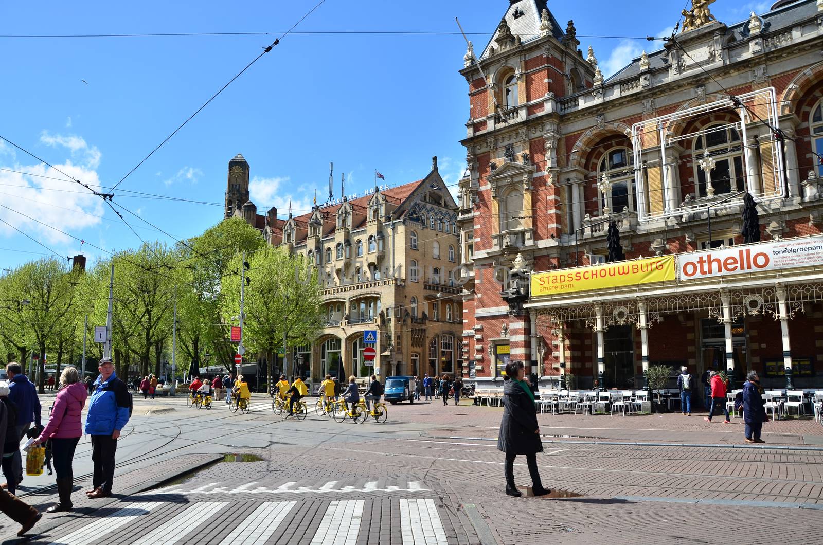 Amsterdam, Netherlands - May 6, 2015: People around Stadsschouwburg building (Municipal theater) at Leidseplein by siraanamwong