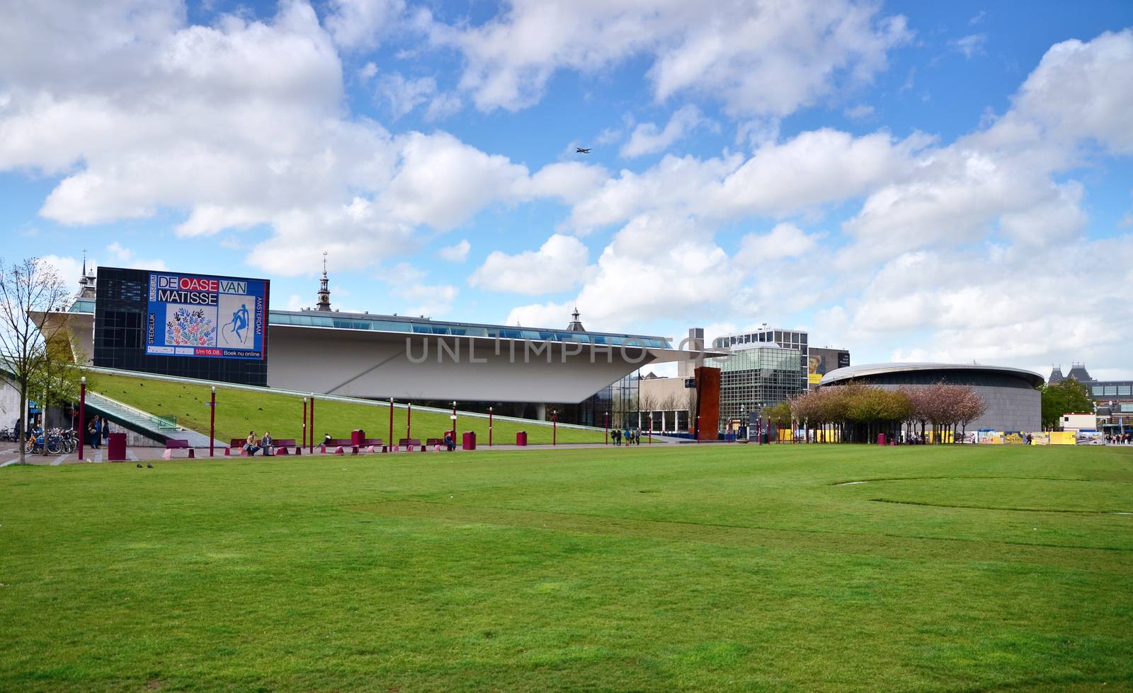 Amsterdam, Netherlands - May 6, 2015: Tourist visit Stedelijk Museum and Van Gogh in Amsterdam located in the museum park, Netherlands on May 6, 2015