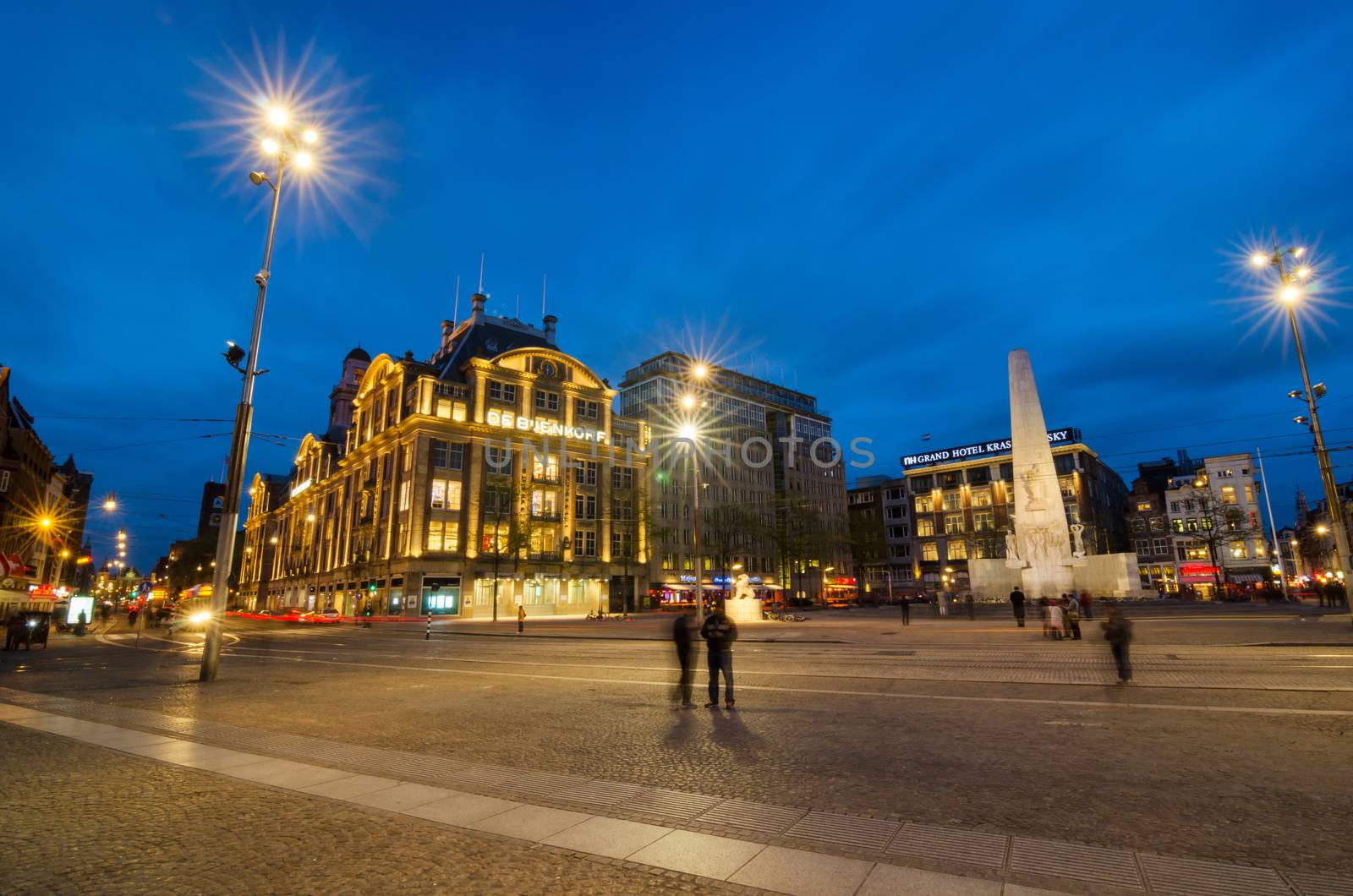 Amsterdam, Netherlands - May 7, 2015: People visit The Dam monument in Amsterdam by siraanamwong