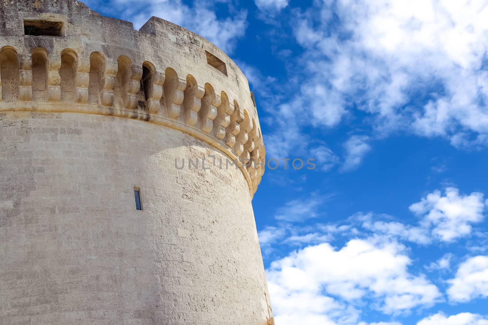 old tower of castle under blue sky with cloud in Matera Italy