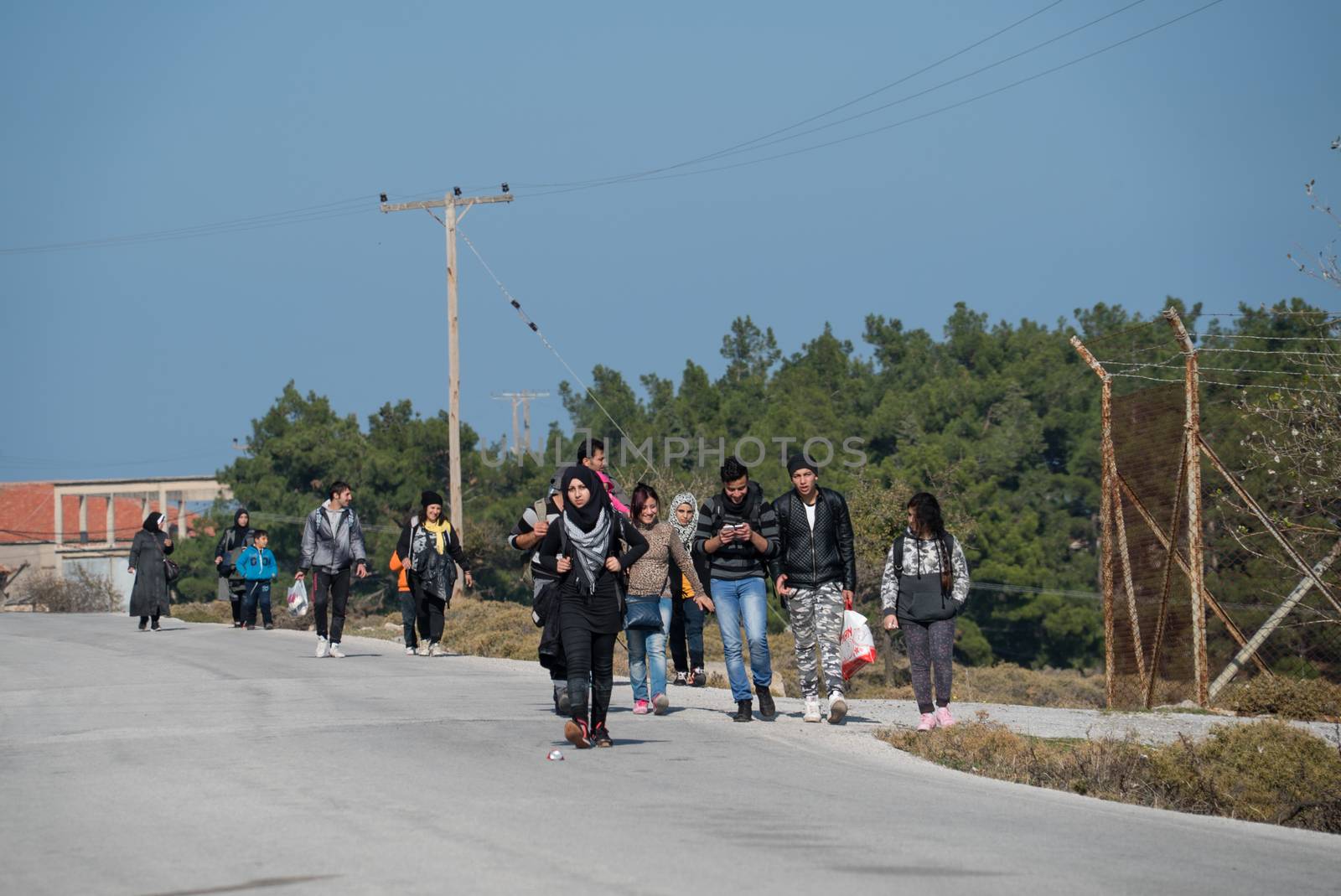GREECE, Lesbos: A fresh group of refugees arrive under the supervision of the Greek and Turkish coast guards on November 8, 2015