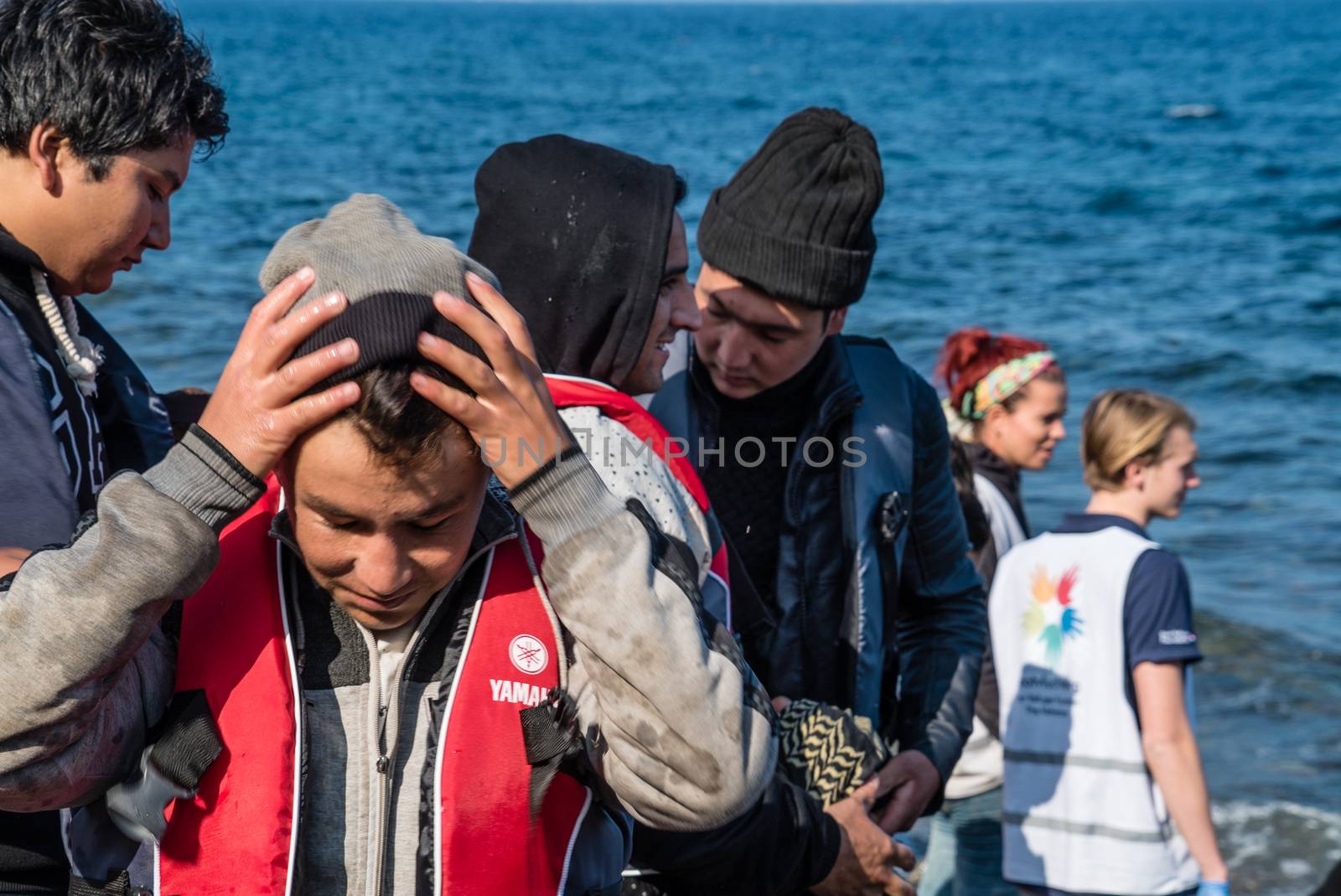 GREECE, Lesbos: A fresh group of refugees arrive under the supervision of the Greek and Turkish coast guards on November 8, 2015