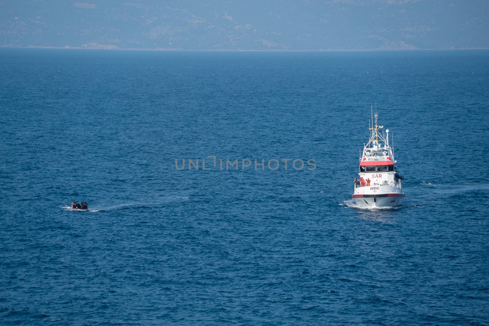 GREECE, Lesbos: A fresh group of refugees arrive under the supervision of the Greek and Turkish coast guards on November 8, 2015