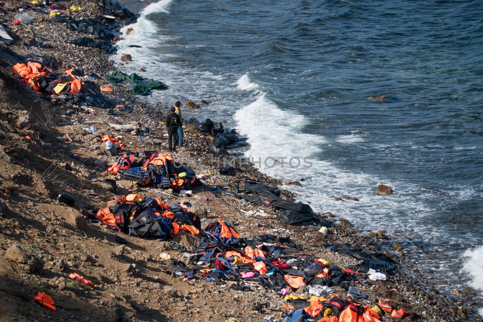 GREECE, Lesbos: The northern coast of the Greek island of Lesbos is covered with thousands of orange life jackets on November 8, 2015. A fresh group of refugees arrive under the supervision of the Greek and Turkish coast guards.  
