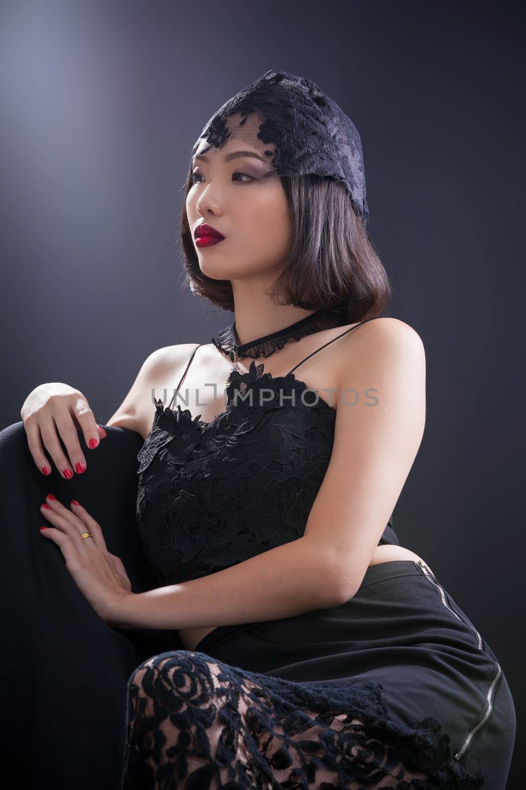 Portrait of beautiful Thai young girl on black background