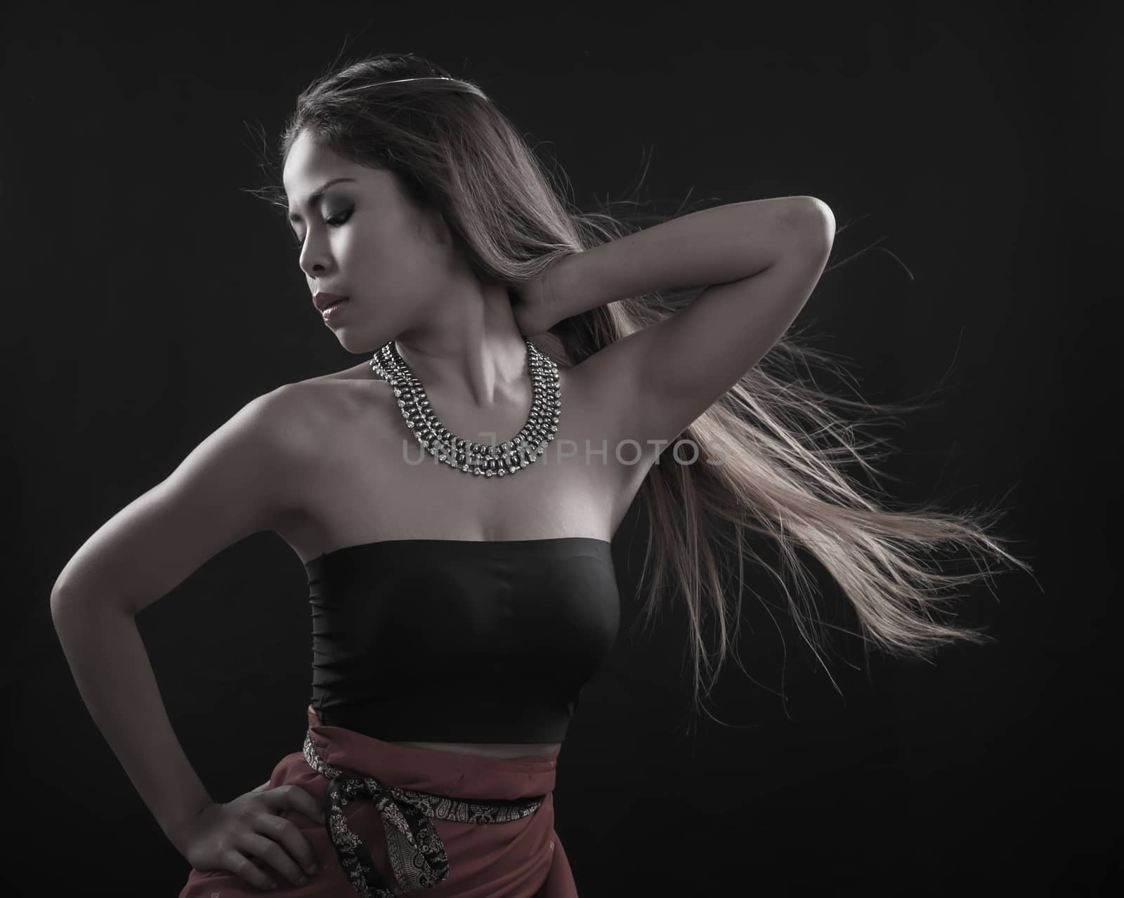 Portrait of Asian woman on black background