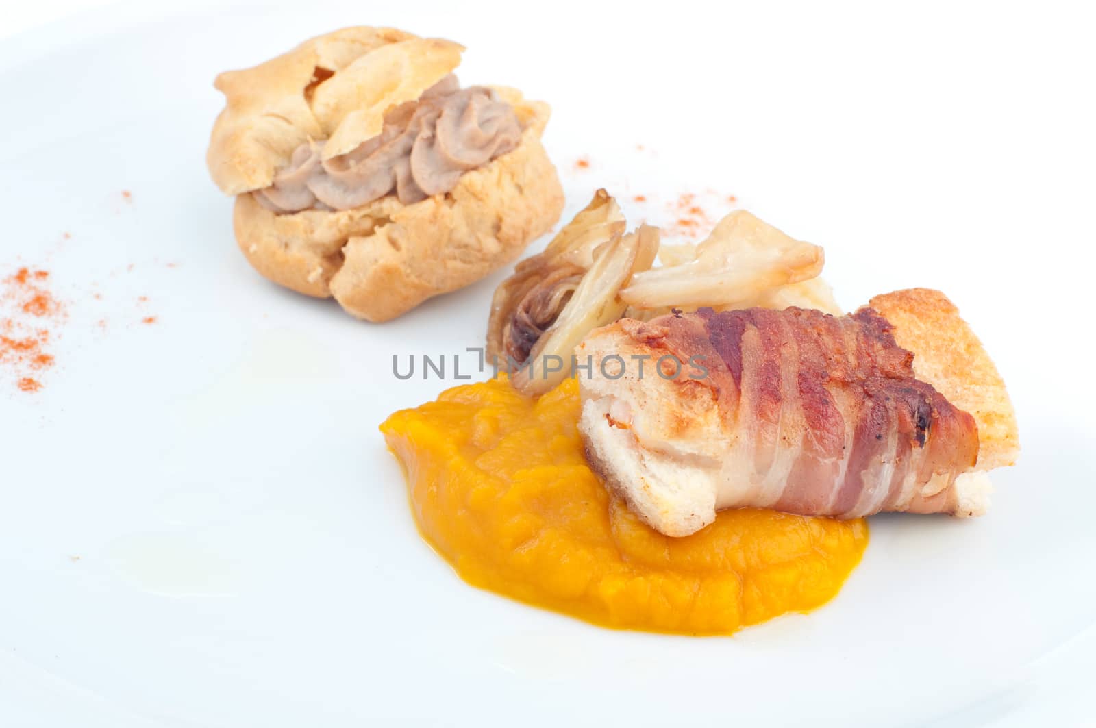 Typical Italian appetizer with liver pate and bacon