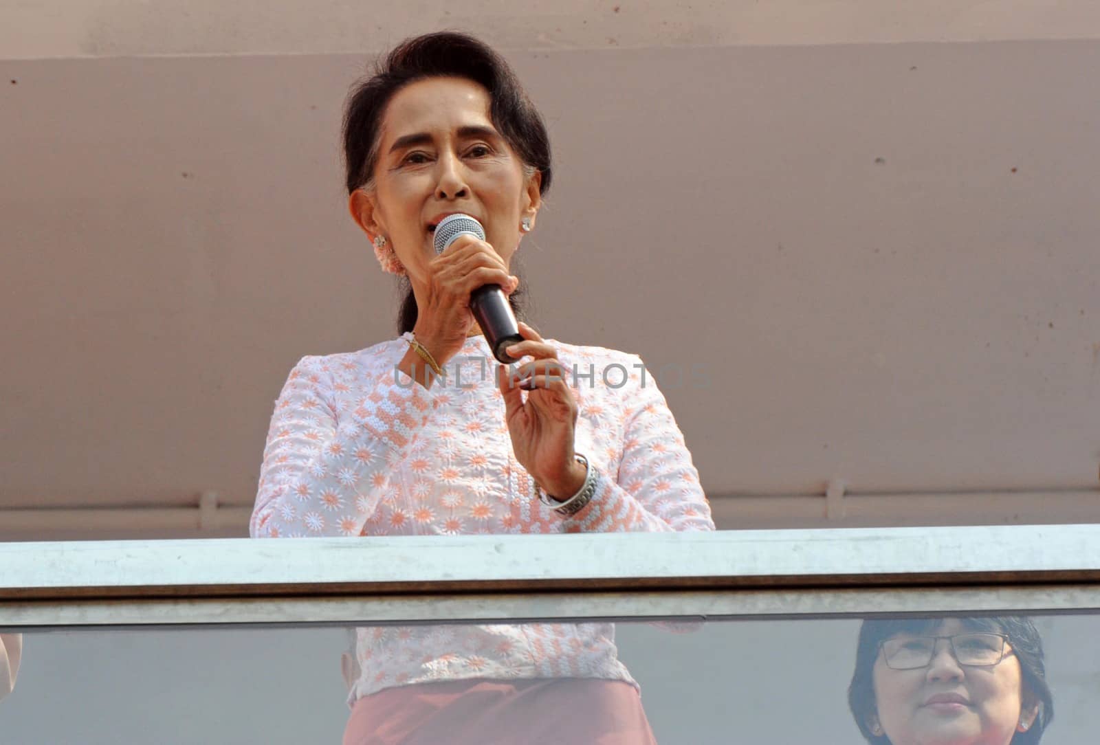MYANMAR, Yangon: Myanmar opposition leader Aung San Suu Kyi delivers a speech from the balcony of the National League of Democracy (NLD) headquarters in Yangon on November 9, 2015. Aung San Suu Kyi's opposition party November 9 said they are on course to claim more than 70 percent of seats after Myanmar's poll, a gain that could bring a major power shift from the military. 