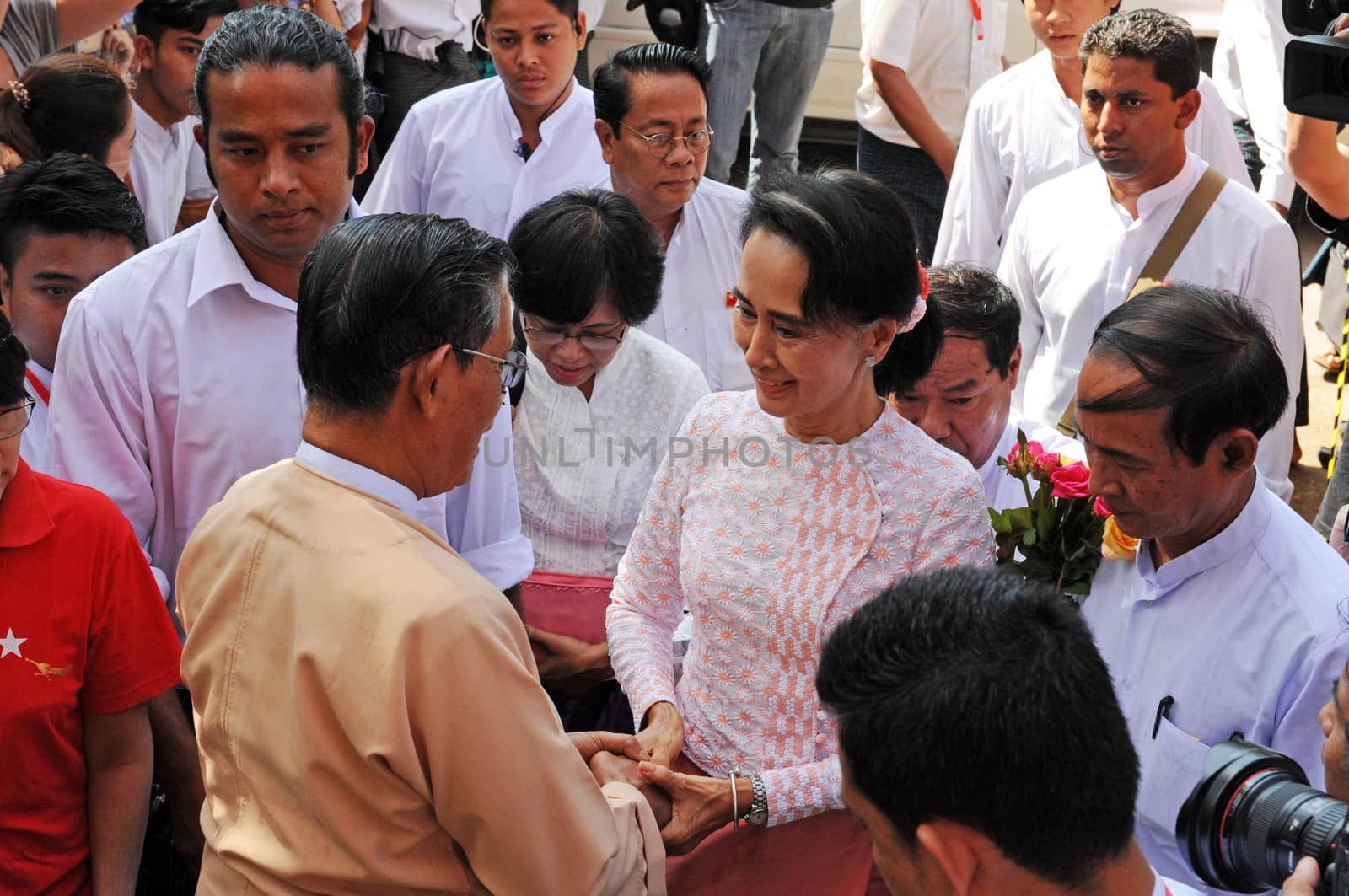 MYANMAR, Yangon: Myanmar opposition leader Aung San Suu Kyi (R) talks with party patron Tin Oo (L) before delivering her speech from the balcony of the National League of Democracy (NLD) headquarters in Yangon on November 9, 2015. Aung San Suu Kyi's opposition party November 9 said they are on course to claim more than 70 percent of seats after Myanmar's poll, a gain that could bring a major power shift from the military.