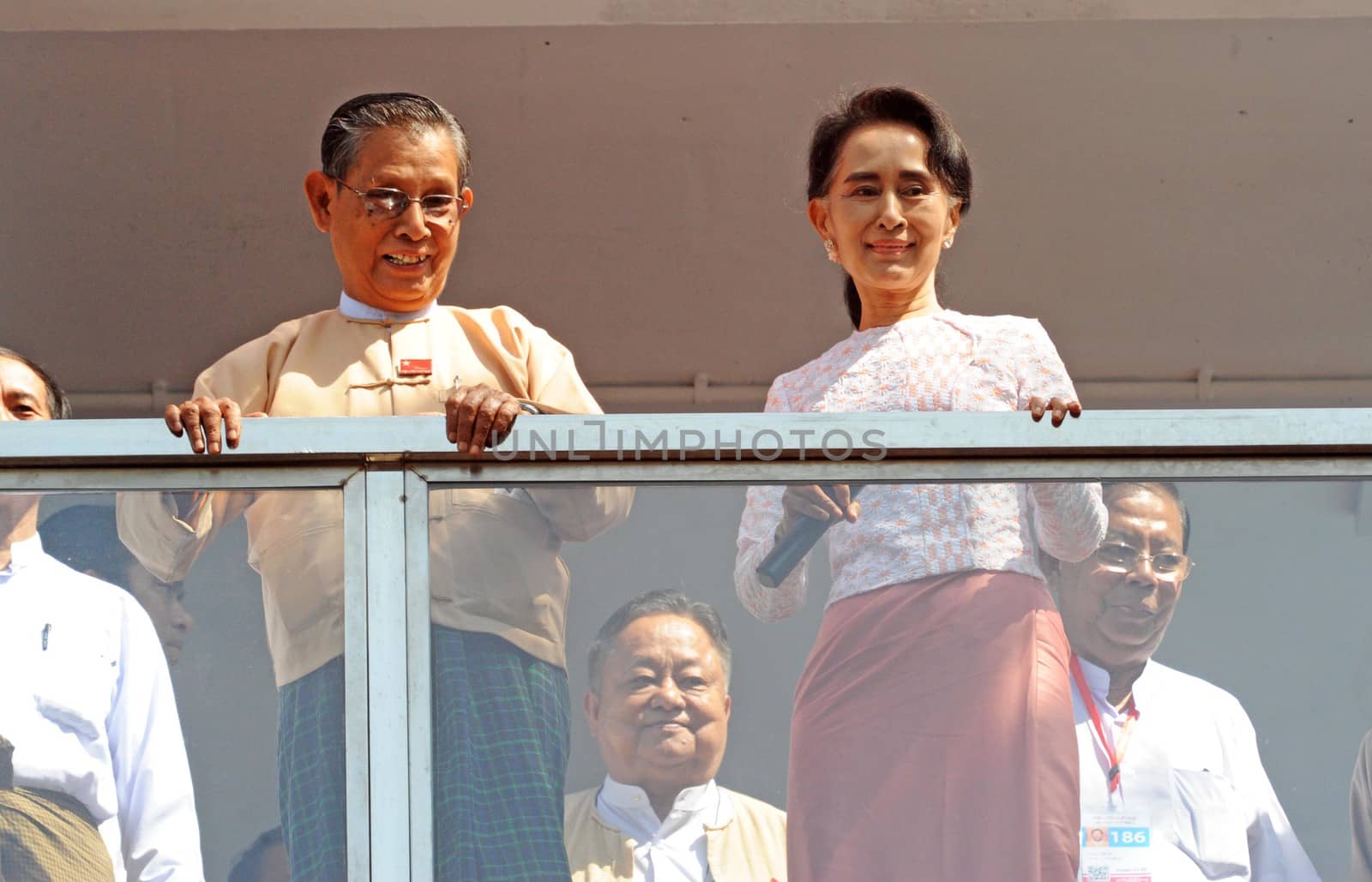 MYANMAR, Yangon: Myanmar opposition leader Aung San Suu Kyi (R), flanked by party patron Tin Oo (L) delivers a speech from the balcony of the National League of Democracy (NLD) headquarters in Yangon on November 9, 2015. Aung San Suu Kyi's opposition party November 9 said they are on course to claim more than 70 percent of seats after Myanmar's poll, a gain that could bring a major power shift from the military. 