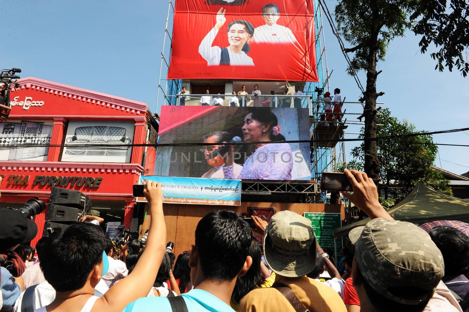 MYANMAR, Yangon: Myanmar opposition leader Aung San Suu Kyi delivers a speech from the balcony of the National League of Democracy (NLD) headquarters in Yangon on November 9, 2015. Aung San Suu Kyi's opposition party November 9 said they are on course to claim more than 70 percent of seats after Myanmar's poll, a gain that could bring a major power shift from the military. 