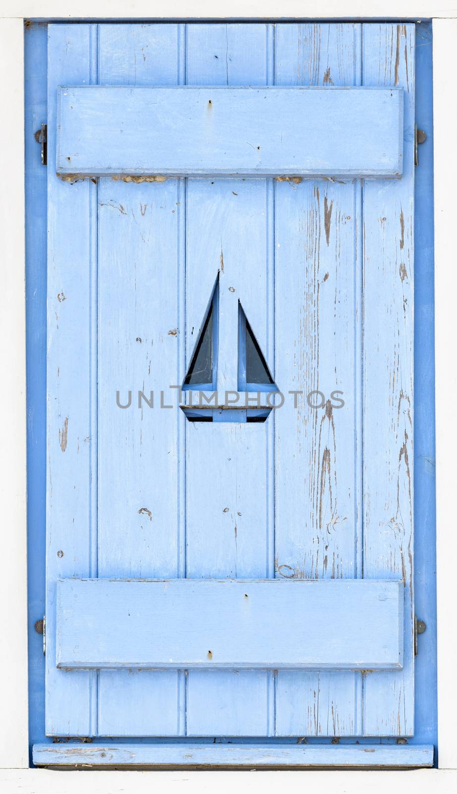 Sail boat on blue wooden shutter