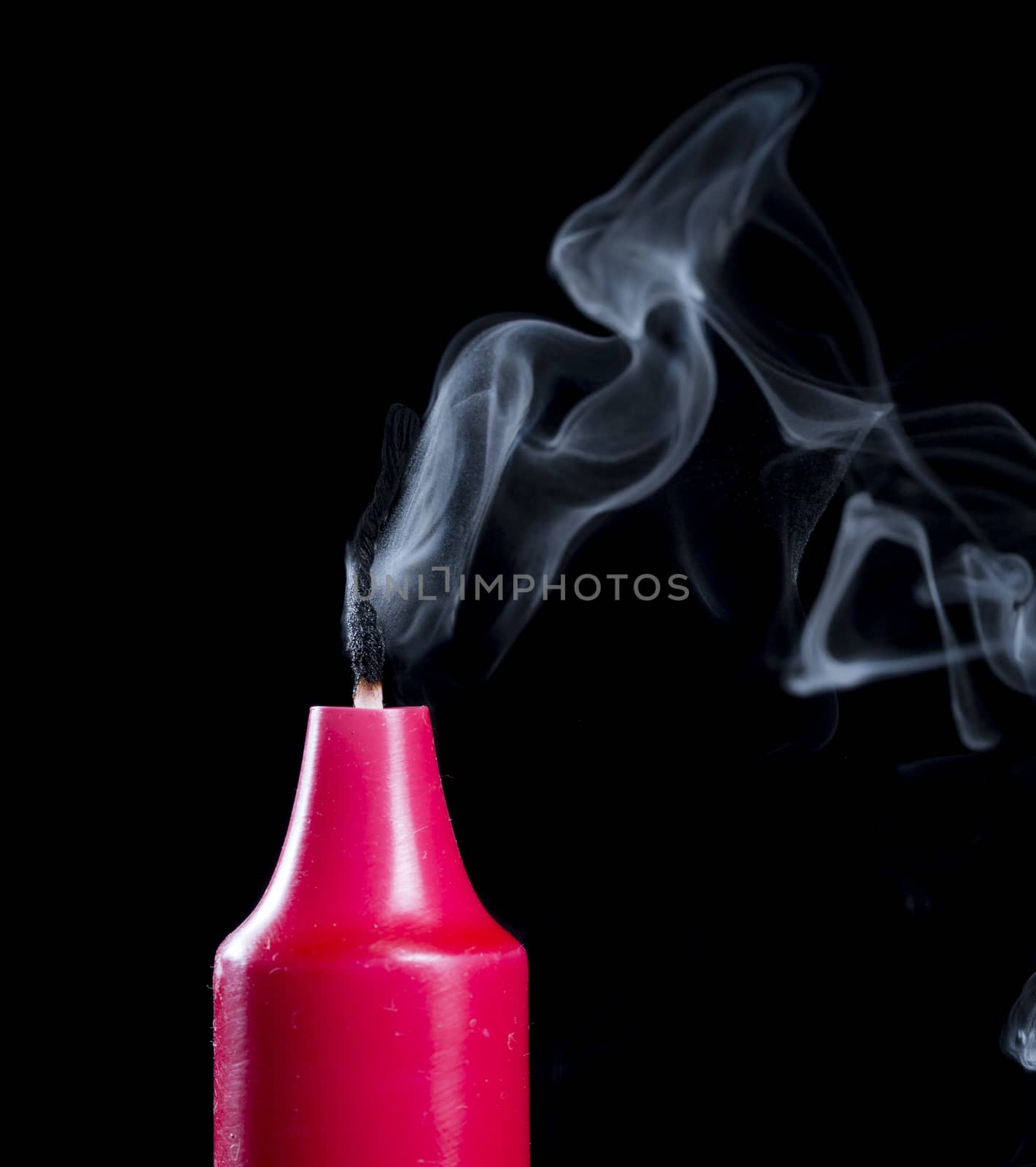 Candle Stick With Smoke on black background.