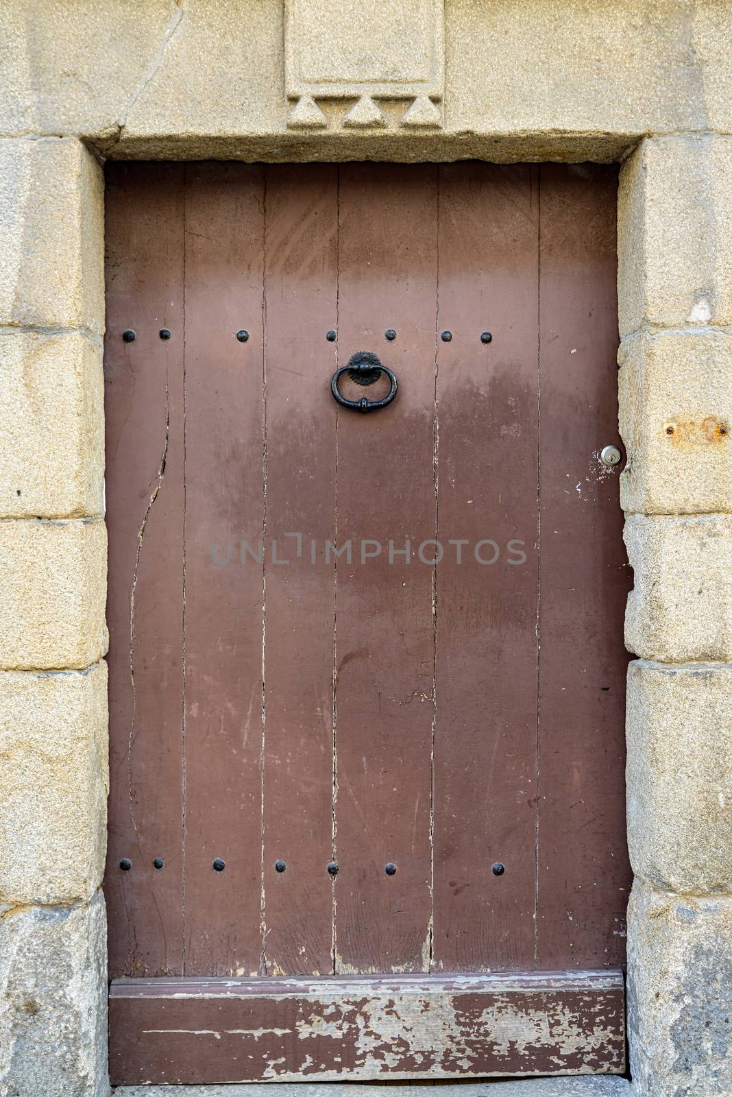 Old wooden door by dutourdumonde