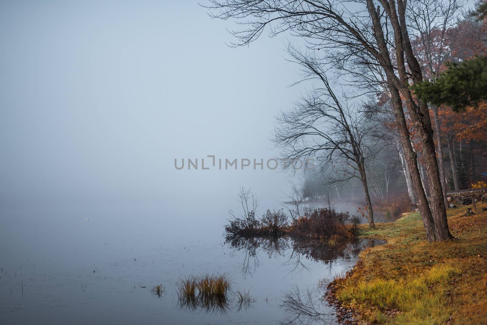 Still, cool air and warm lake water make for an early morning masking of the water in a near opaque fog show.