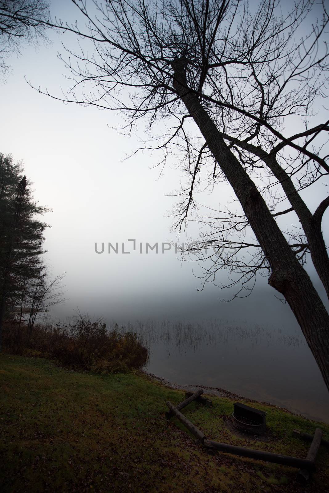 Still, cool air and warm lake water make for an early morning masking of the water in a near opaque fog show.