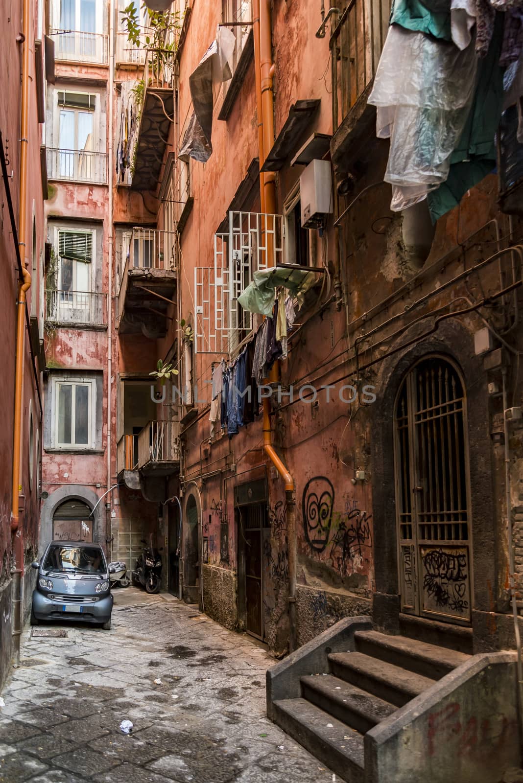 narrow street downtown the city of Naples, Italy