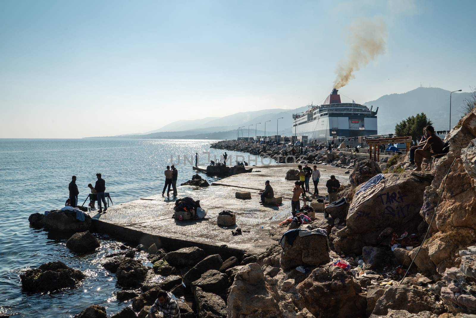 GREECE, Mytilene: Refugees wait to depart from Mytilene, the capital and port city of the Greek island of Lesbos, on November 7, 2015. From there, thousands of refugees will make their way to the Port of Piraeus.