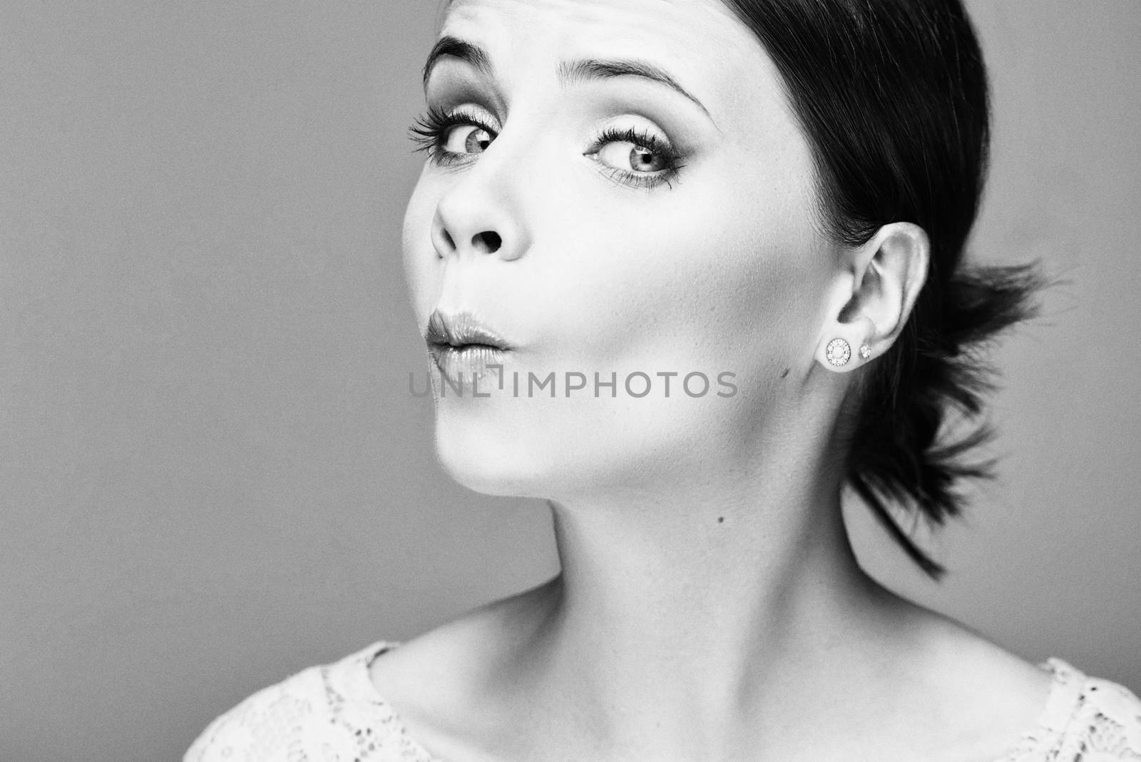 Black and white emotional portrait of a beautiful fashion girl, sweet and sensual.