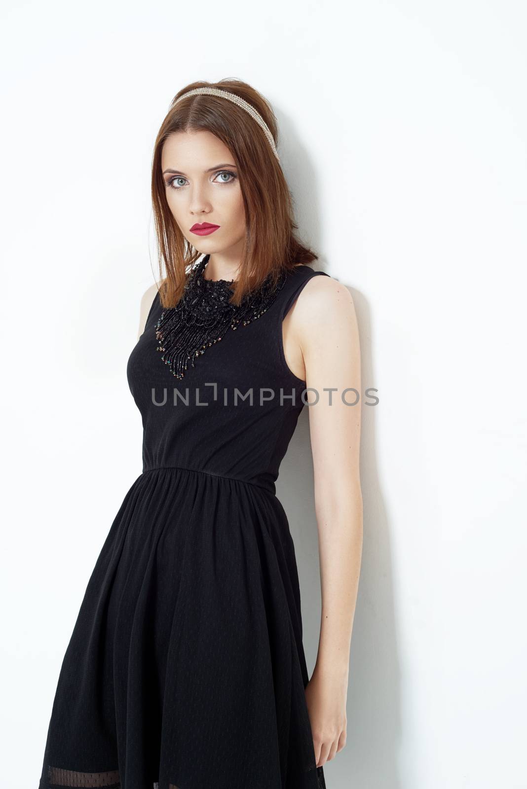 Fashion photo of young magnificent woman. Girl posing. Studio photo