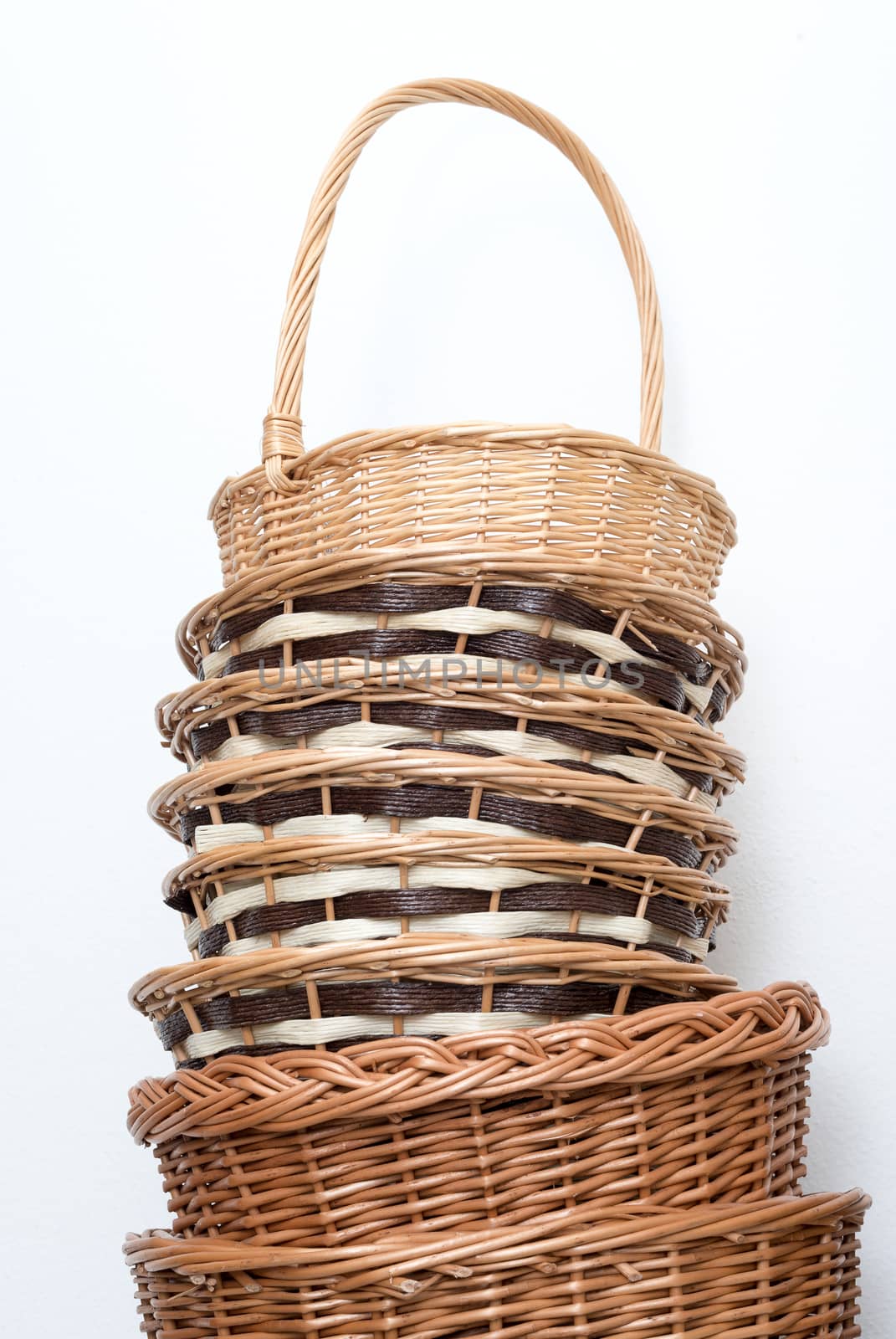 Wicker basket on white background by DNKSTUDIO